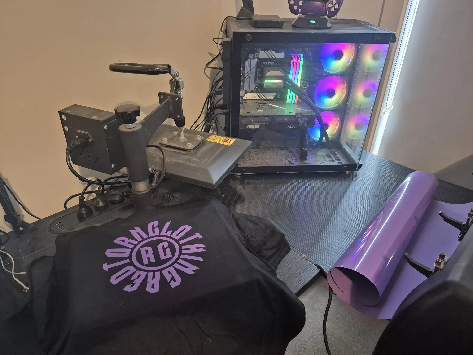 Black t-shirt with purple text and design, likely made of cotton or polyester blend.