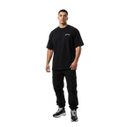 Black oversized cotton unisex classic tee with fire skull graphic and white embroidered logo