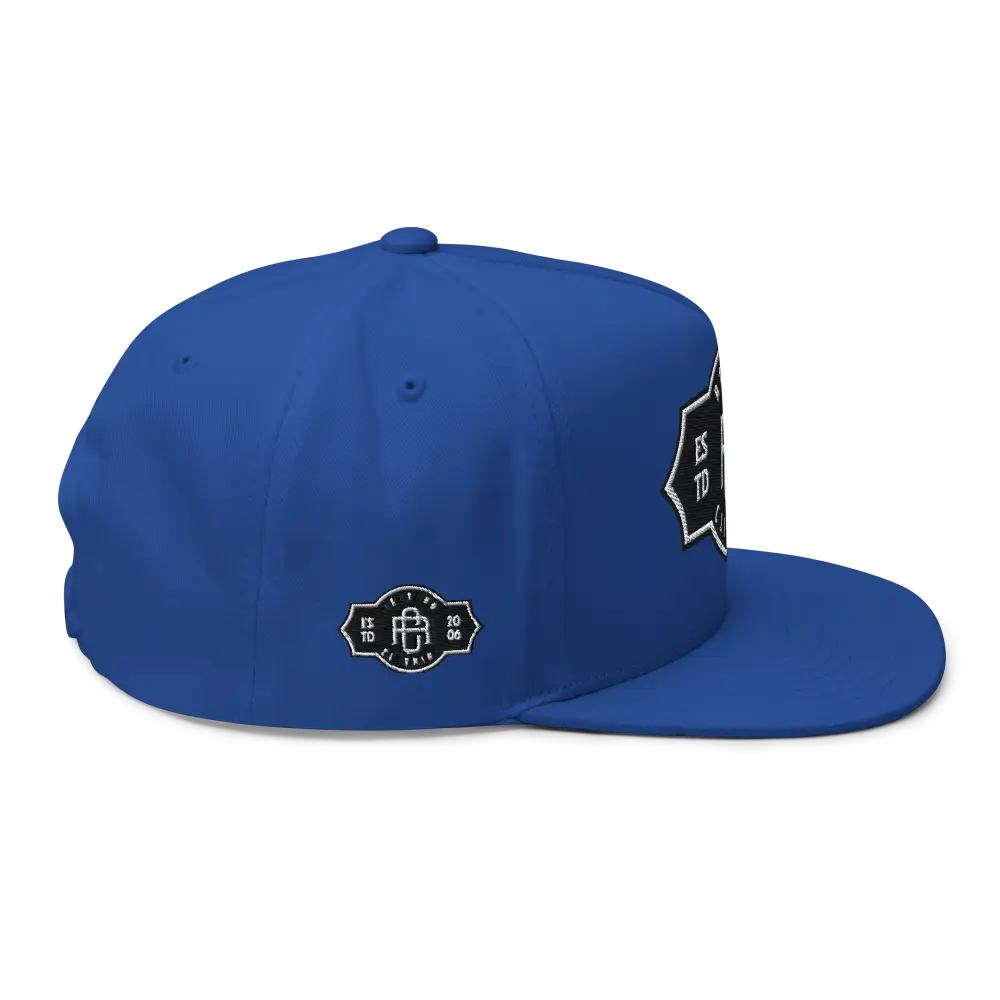 Royal blue RC Monogram flat bill snapback cap with white logo patch