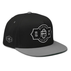 RC Monogram flat bill snapback cap in black and gray with white logo