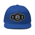 Royal blue flat bill snapback cap with RC monogram logo