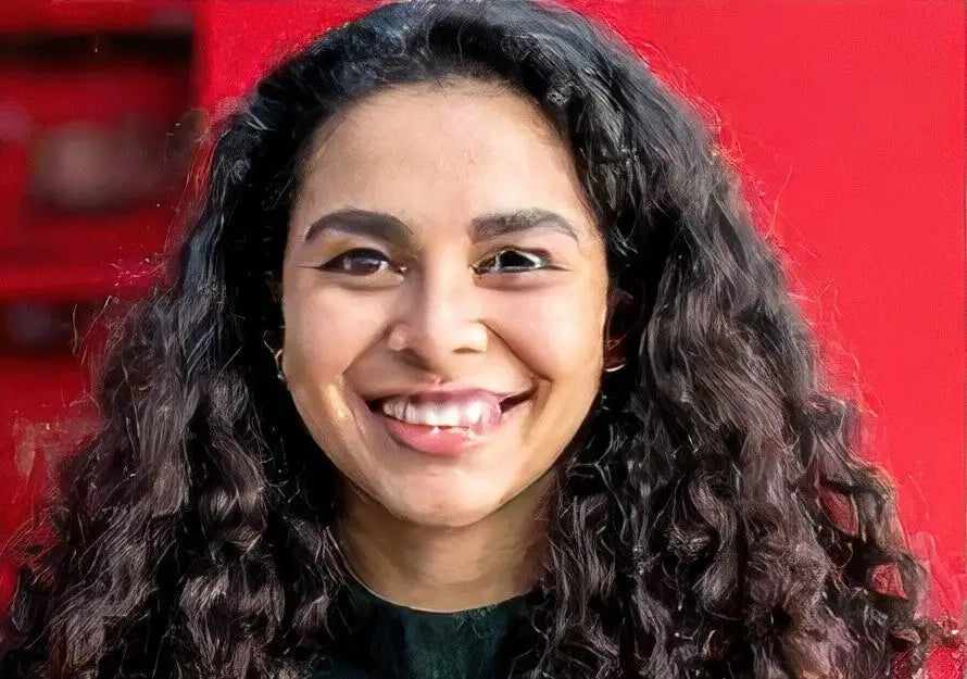 Green v-neck sweater with black trim