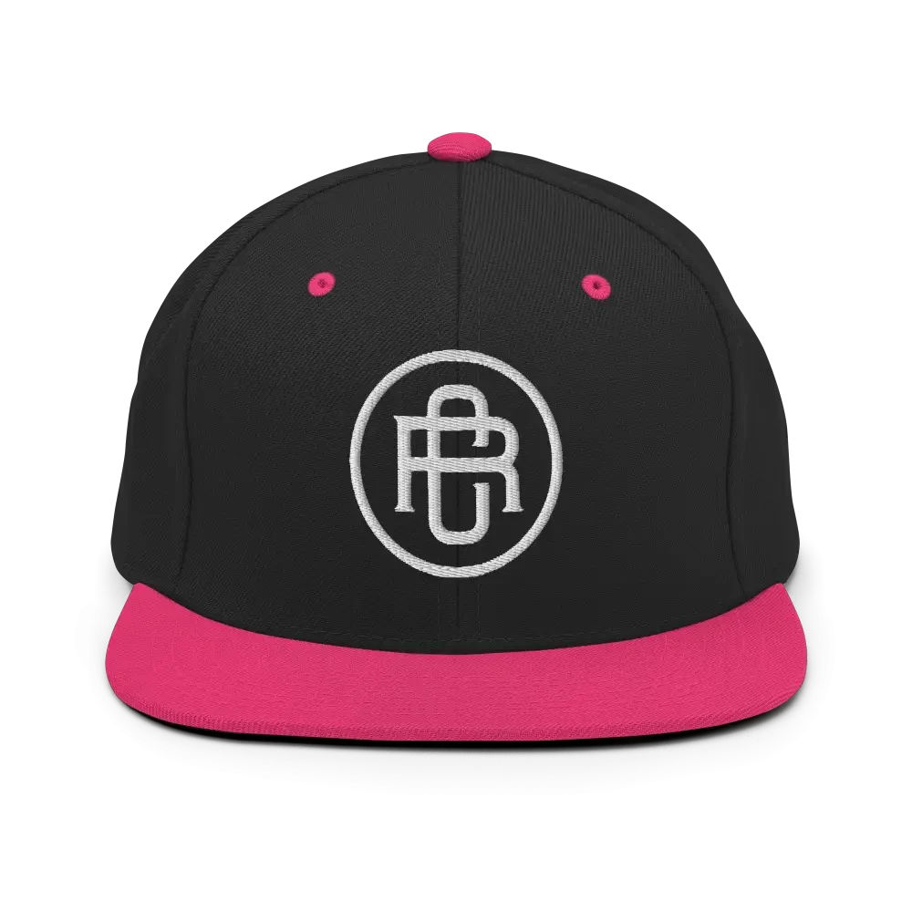 Black and pink RC Circle logo snapback cap with flat bill