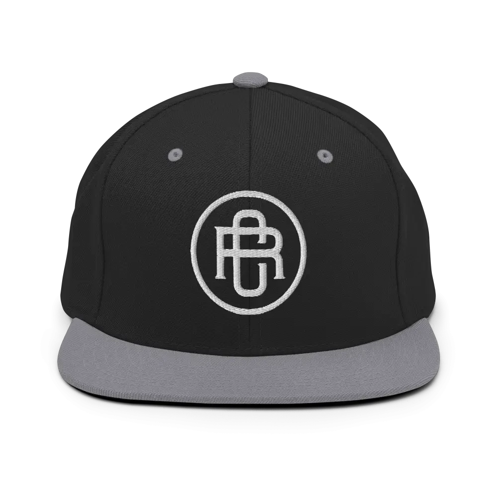 Black and gray RC Circle Logo snapback cap with white flat bill logo