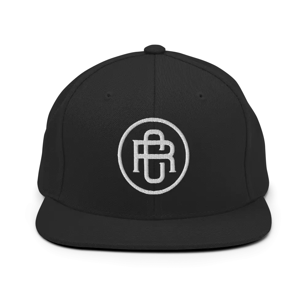 Black RC Circle Logo snapback cap with white flat bill design