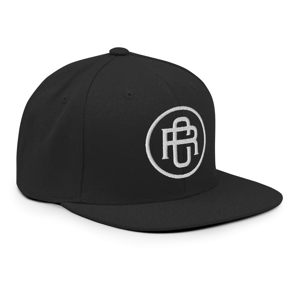 Black flat bill snapback cap with white RC circle logo