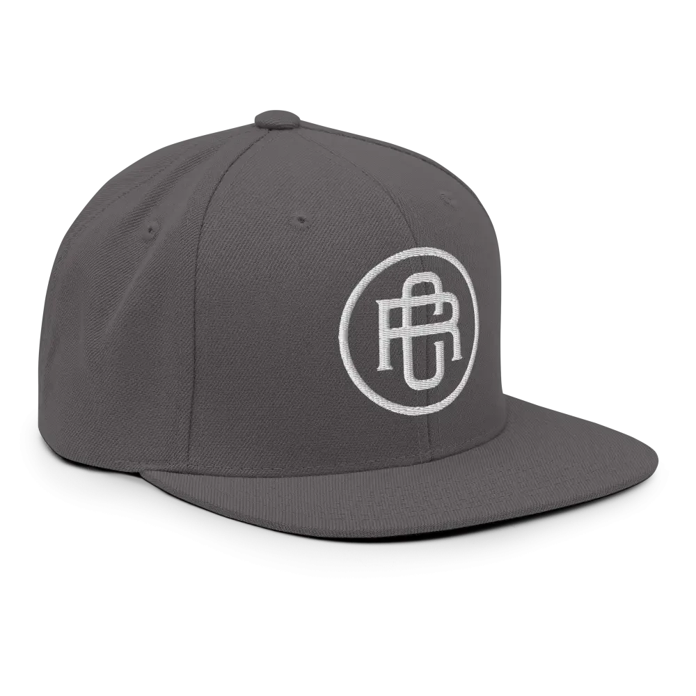 Charcoal gray flat bill snapback cap with white RC Circle logo