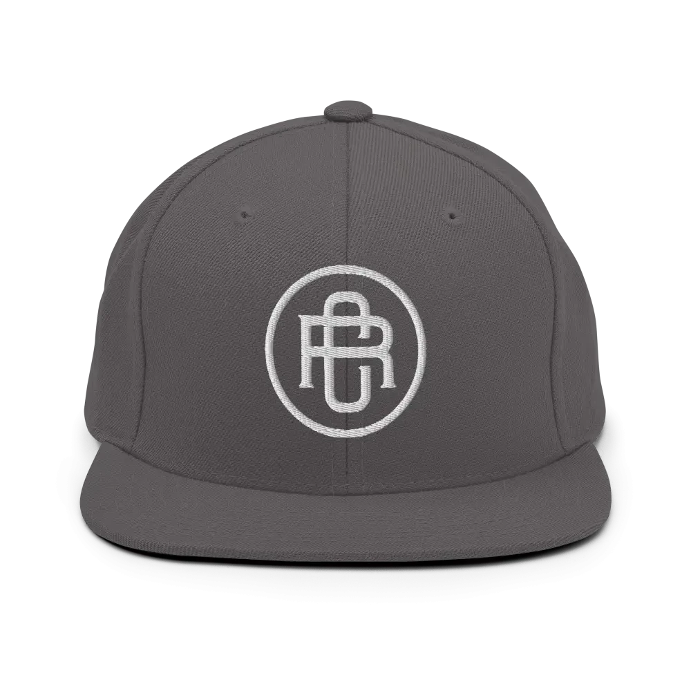 Gray flat bill snapback cap with white RC circle logo